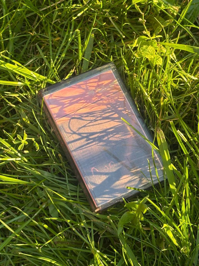 Кассета her last promise «Выход» в траве на солнце